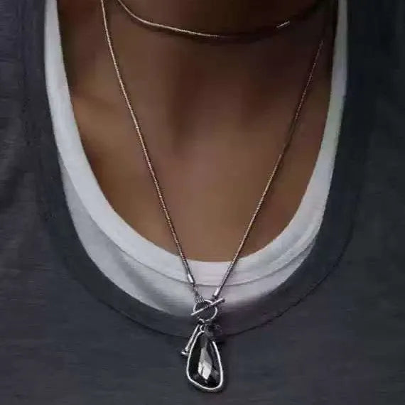 Women's long geometric pendant necklace with snake bone chain in blue, champagne or grey colour