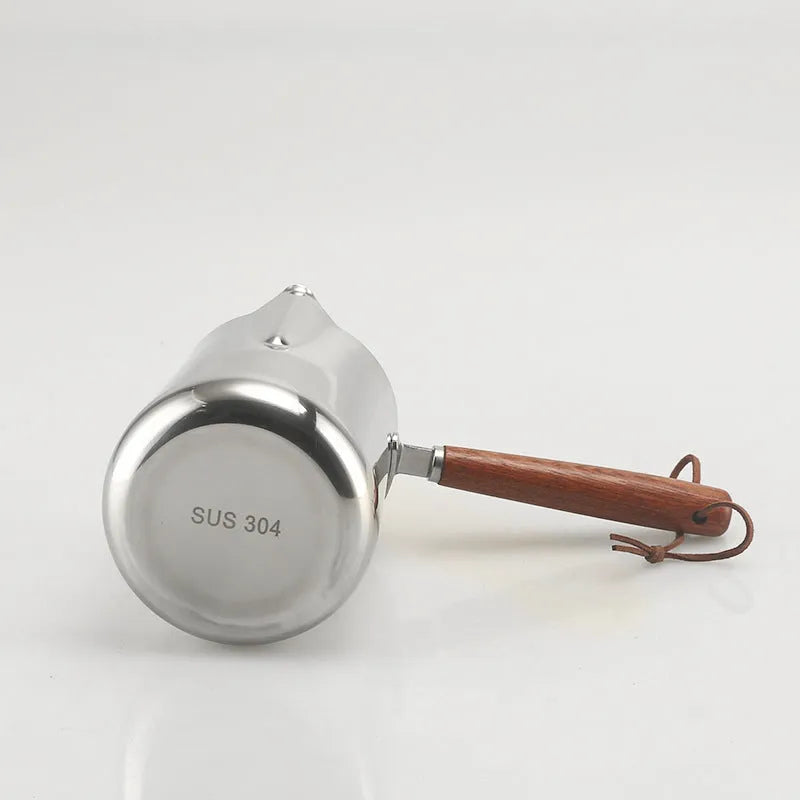 Stainless steel coffee cup with wooden handle and internal measuring scale.