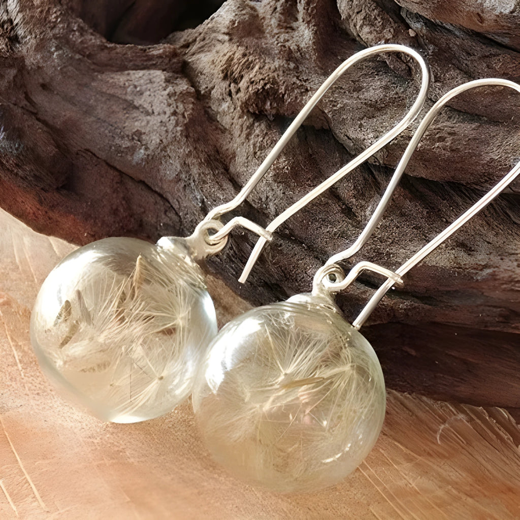 Transparent 16mm glass ball earrings with dandelion seed design on French hooks