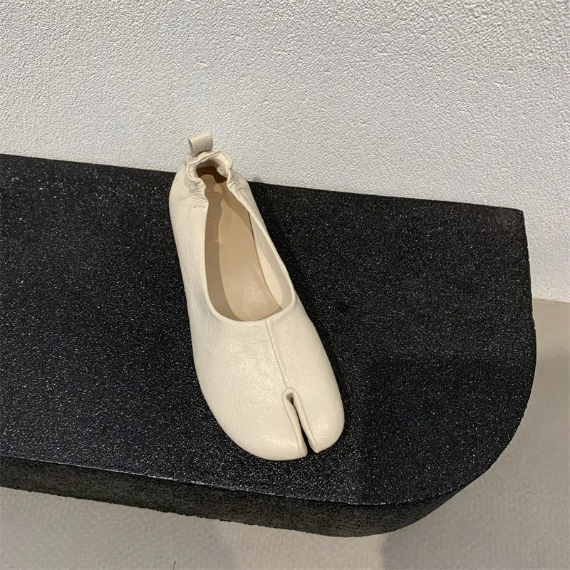 Women's black low heel pumps with split toe design and chunky heel