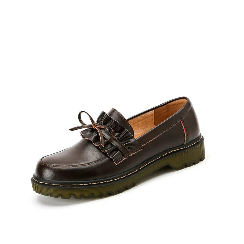 Women's black leather chunky heel shoes with a round toe and low-top design.