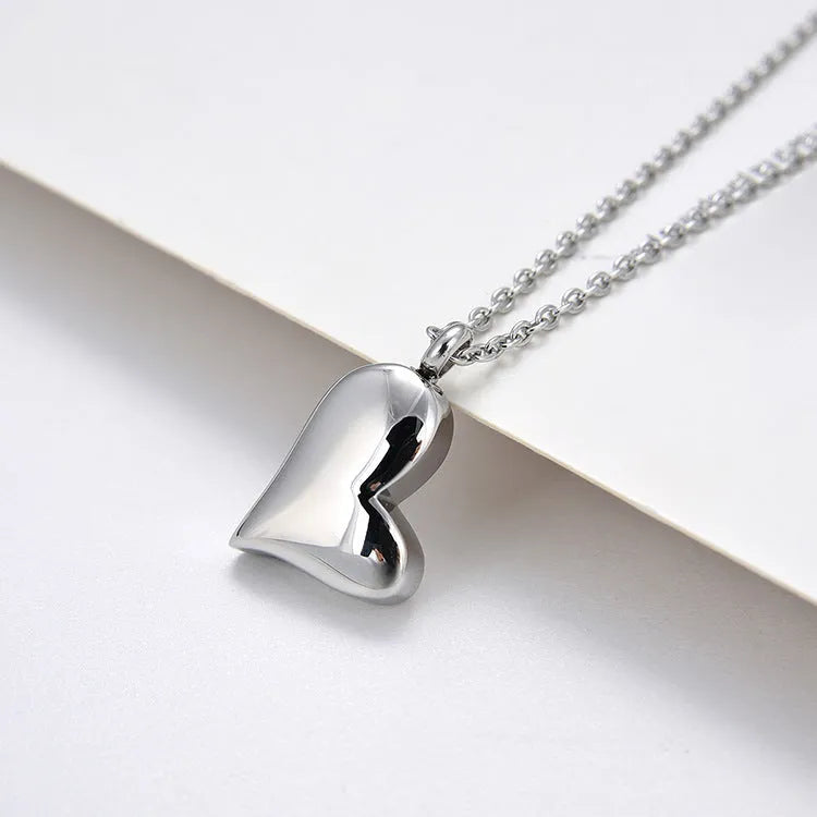 Silver stainless steel necklace with heart pendant on adjustable chain