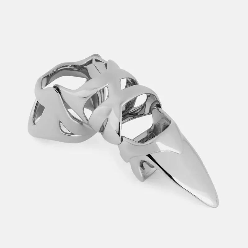 Silver coloured alloy punk armour finger stall ring on a hand.