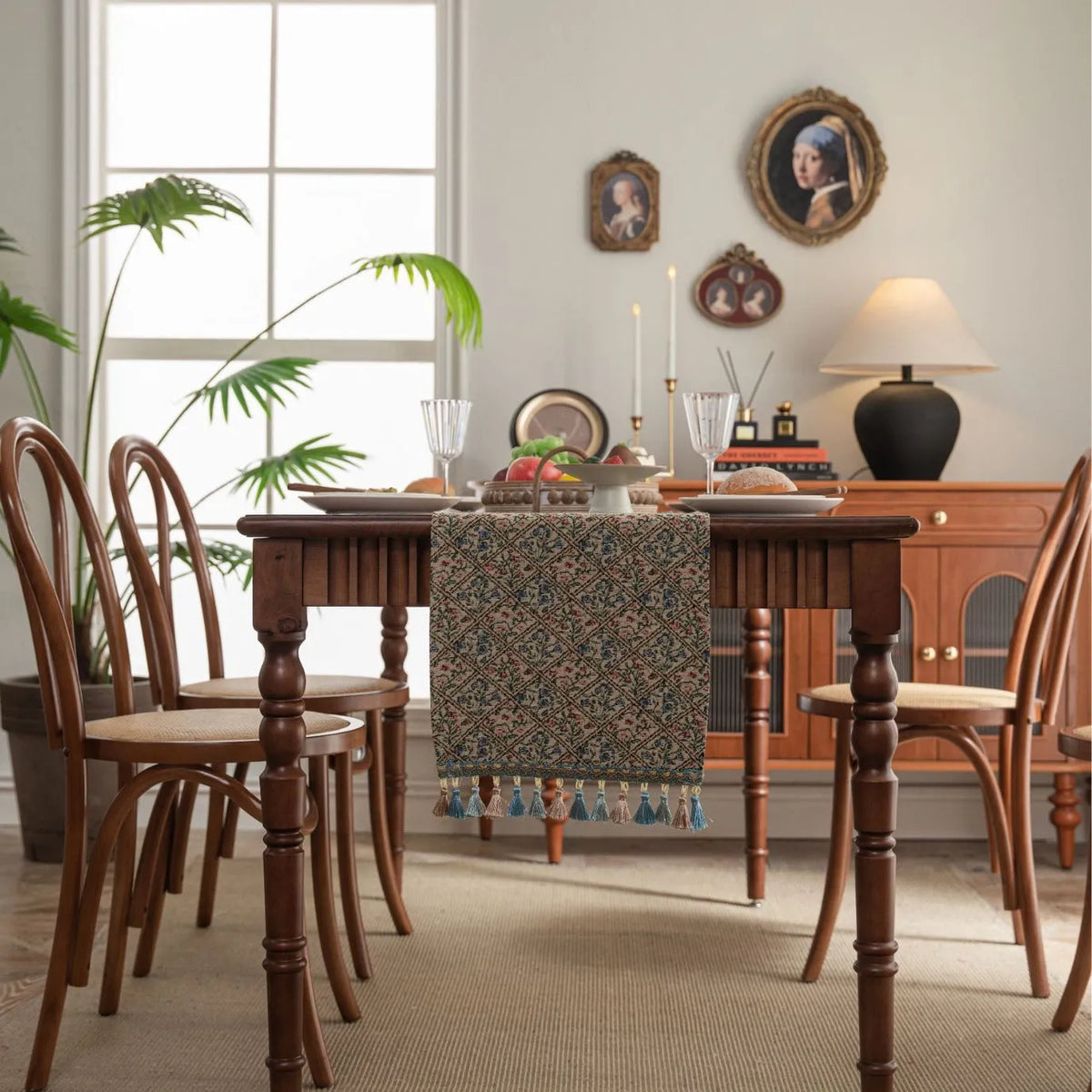 Dark blue striped floral jacquard table runner laid flat on a wooden dining table.