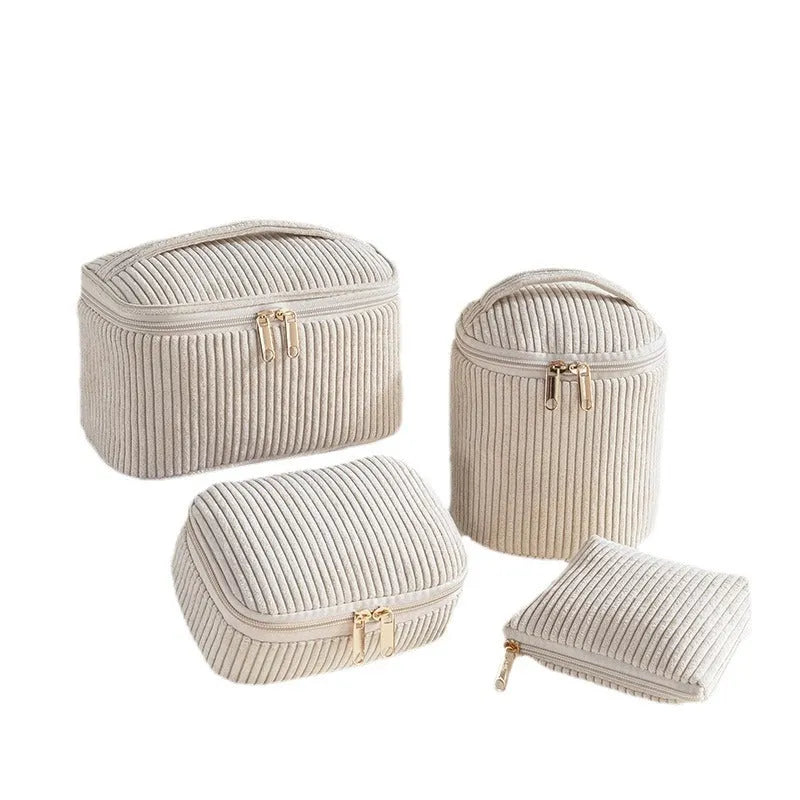 Four coordinating flannelette makeup bags in cube design with polyester construction