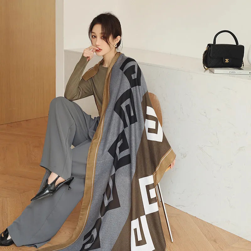 A woman wearing a printed polyester scarf, showing one of three style options, with dimensions of 180cm by 90cm.