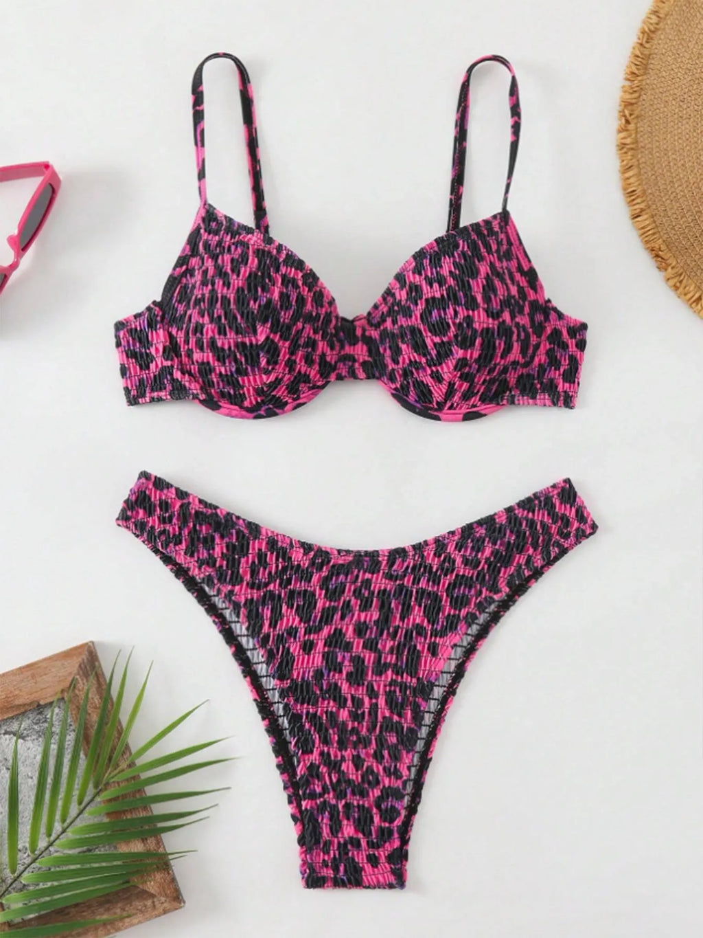 Women's leopard print backless bikini swimsuit in brown mixed colour, showing briefs style and sleeveless design.