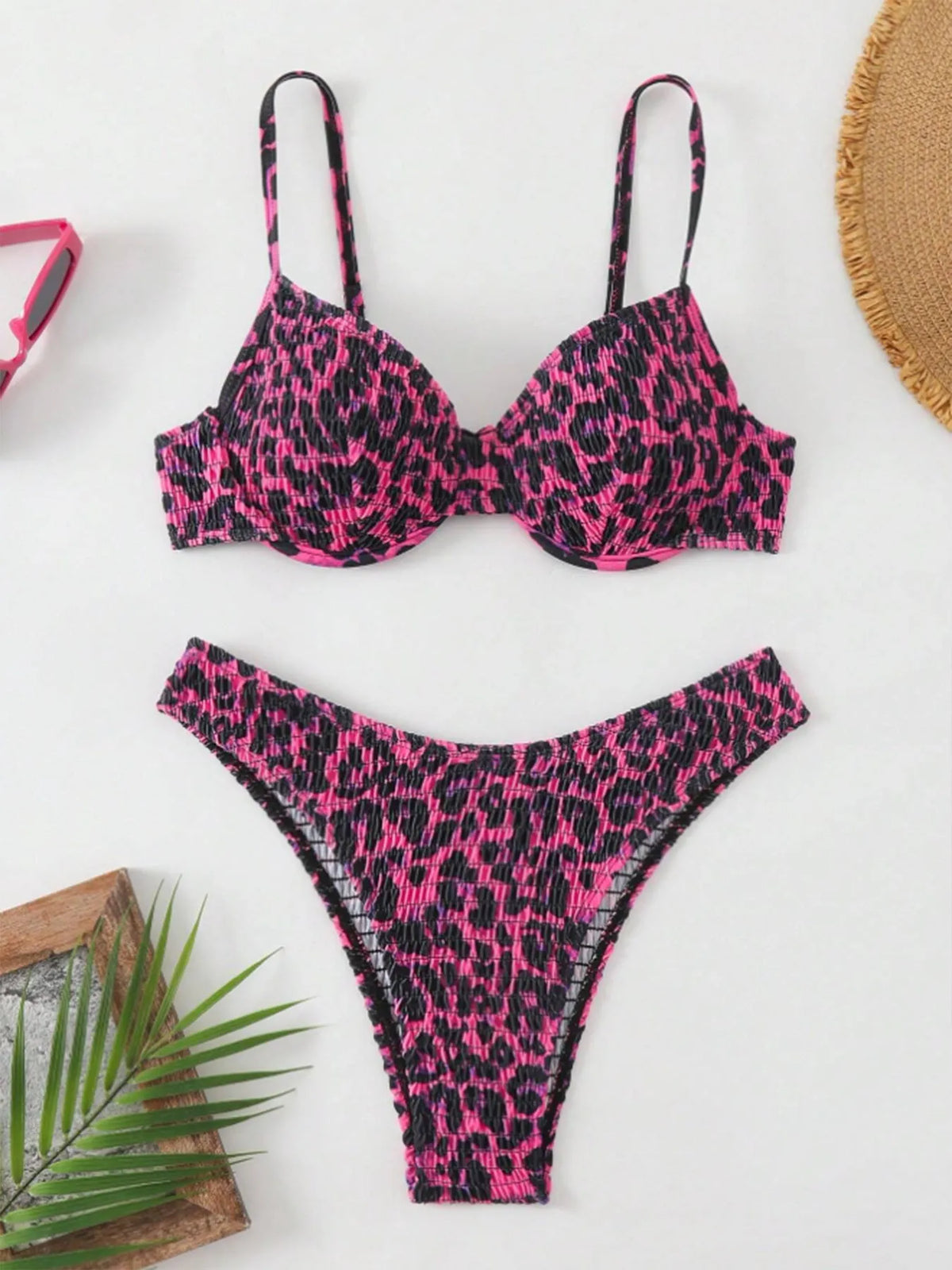 Women's leopard print backless bikini swimsuit in brown mixed colour, showing briefs style and sleeveless design.