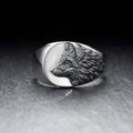 Men's silver alloy ring with geometric domineering wolf shape design on a hand.