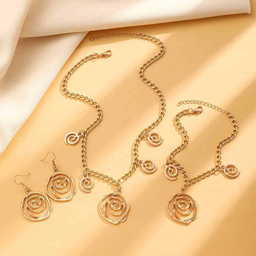 Spiral donut jewellery set with geometric circle designs including adjustable necklace, bracelet and ear hooks