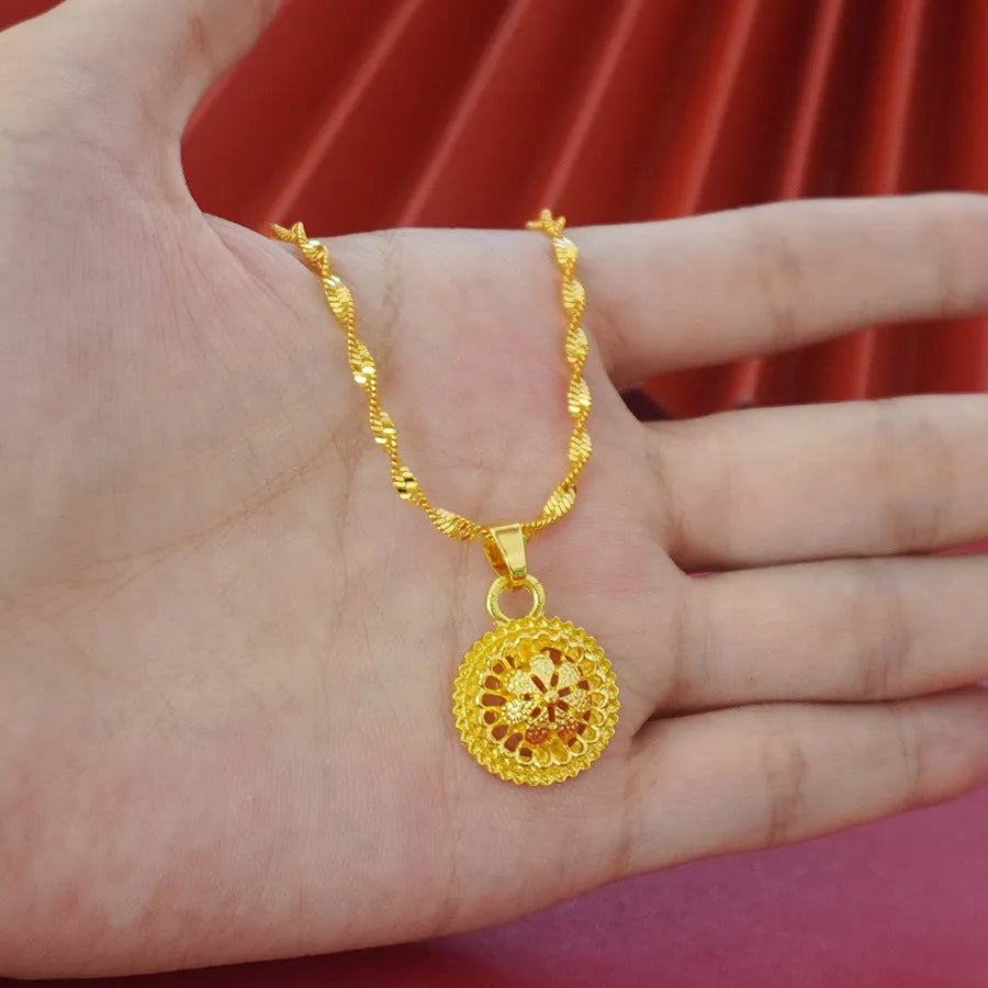 Gold-plated three-piece jewellery set with floral pendant design including necklace, earrings and ring