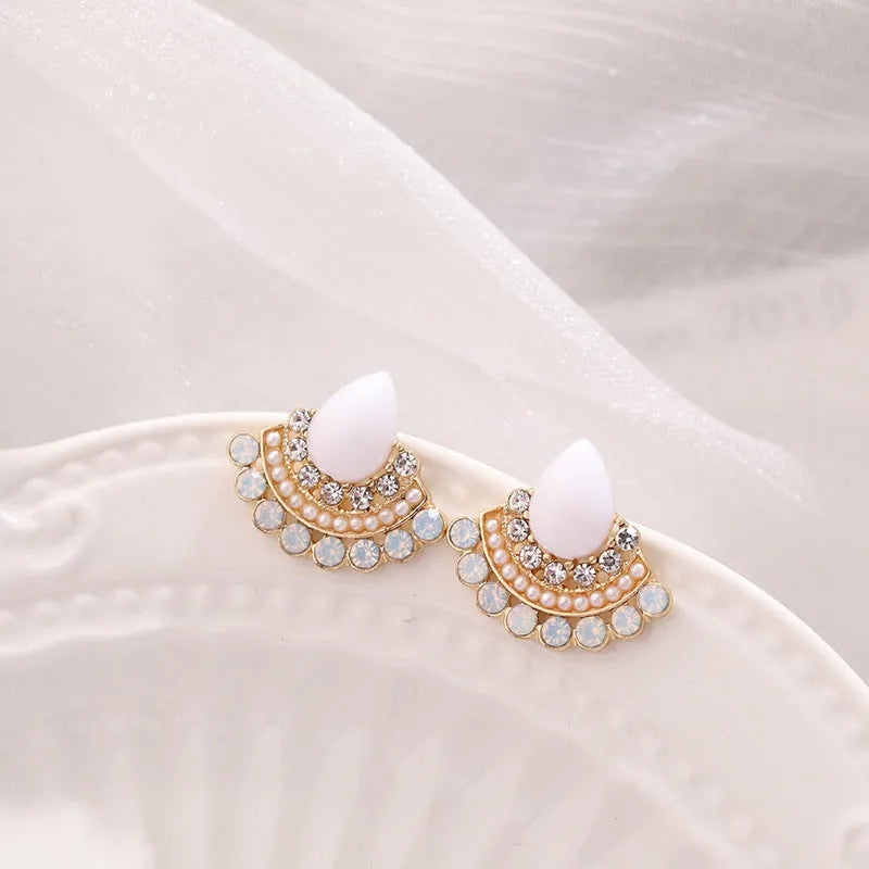Women's silver retro fan-shaped earrings with opal centre and rhinestone detailing on geometric design