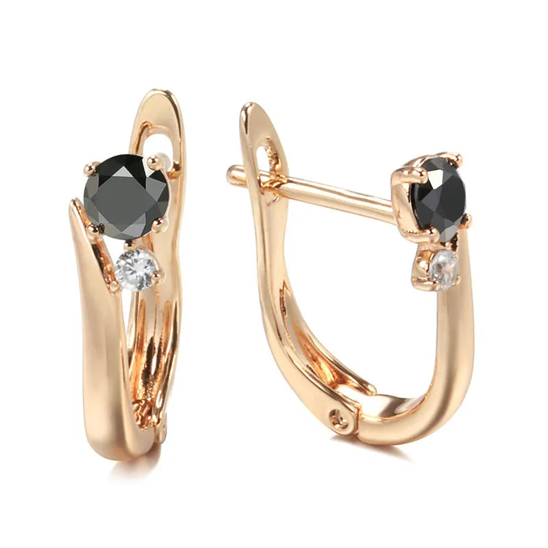 Gold geometric drop earrings with black stone inlay, retro style for women.