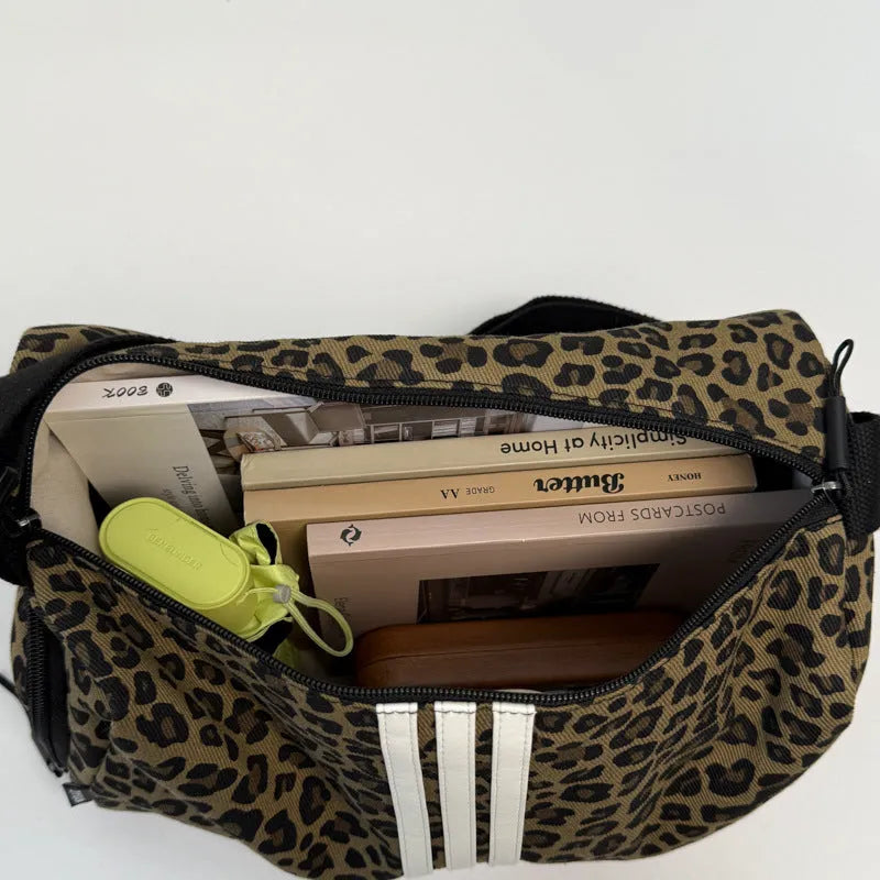 Leopard print sports style shoulder messenger bag with stitching detail and cross-body strap