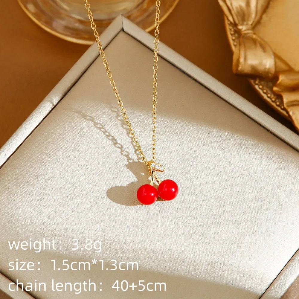 Women's titanium steel necklace with detailed pepper, strawberry and cherry pendants on O-ring chain