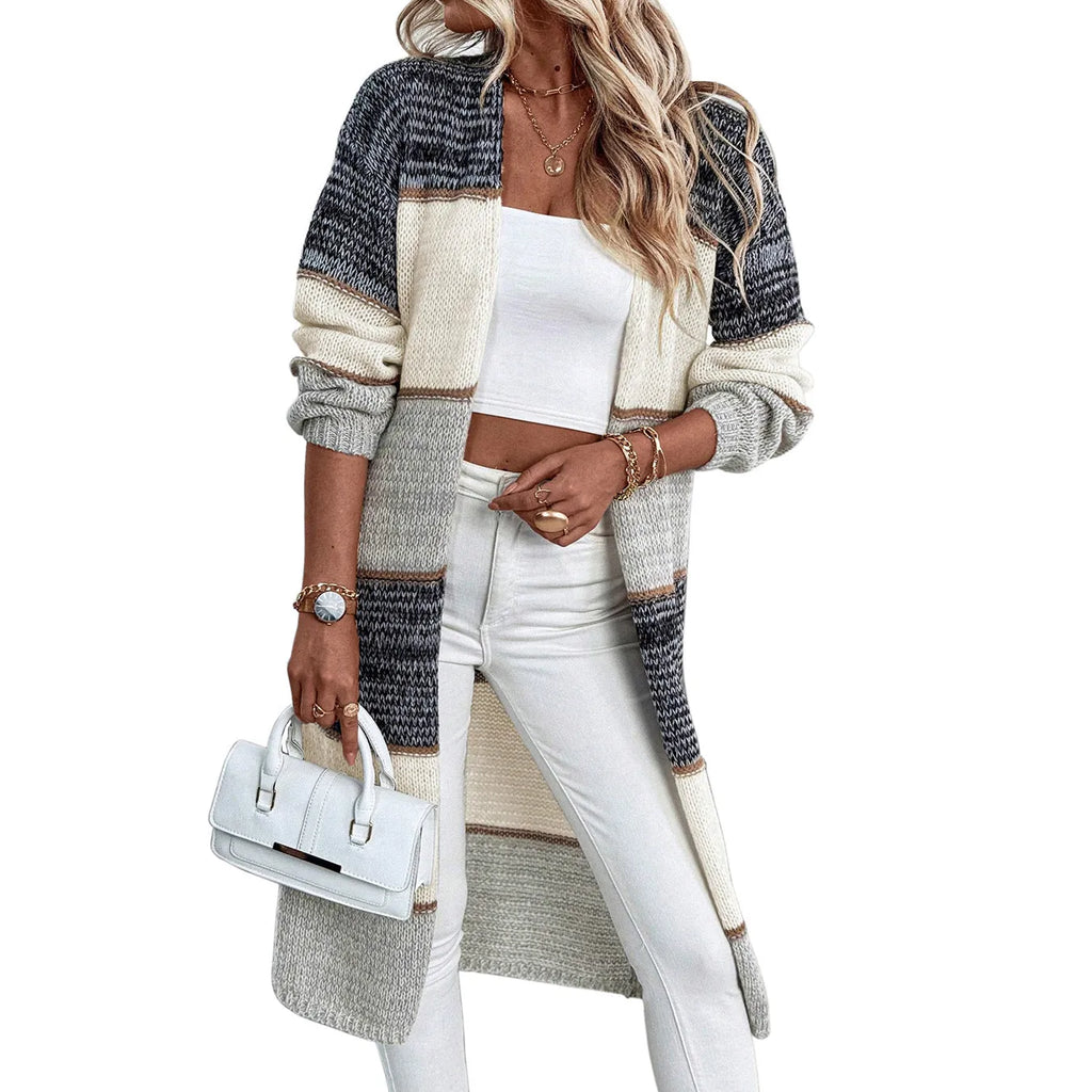 Grey knitted women's cardigan with loose fit design and long sleeves