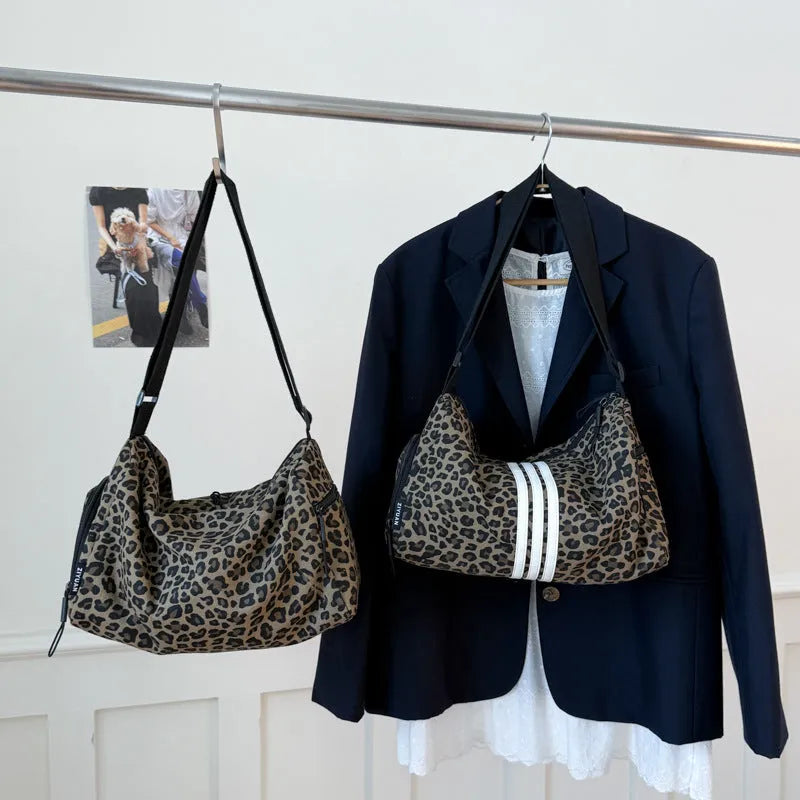 Leopard print sports style shoulder messenger bag with stitching detail and cross-body strap