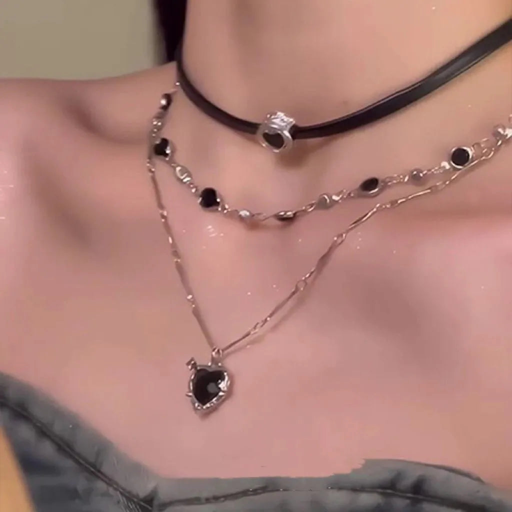 Women's adjustable twin necklace set with leather heart pendants, alloy chain, and artificial crystal accents