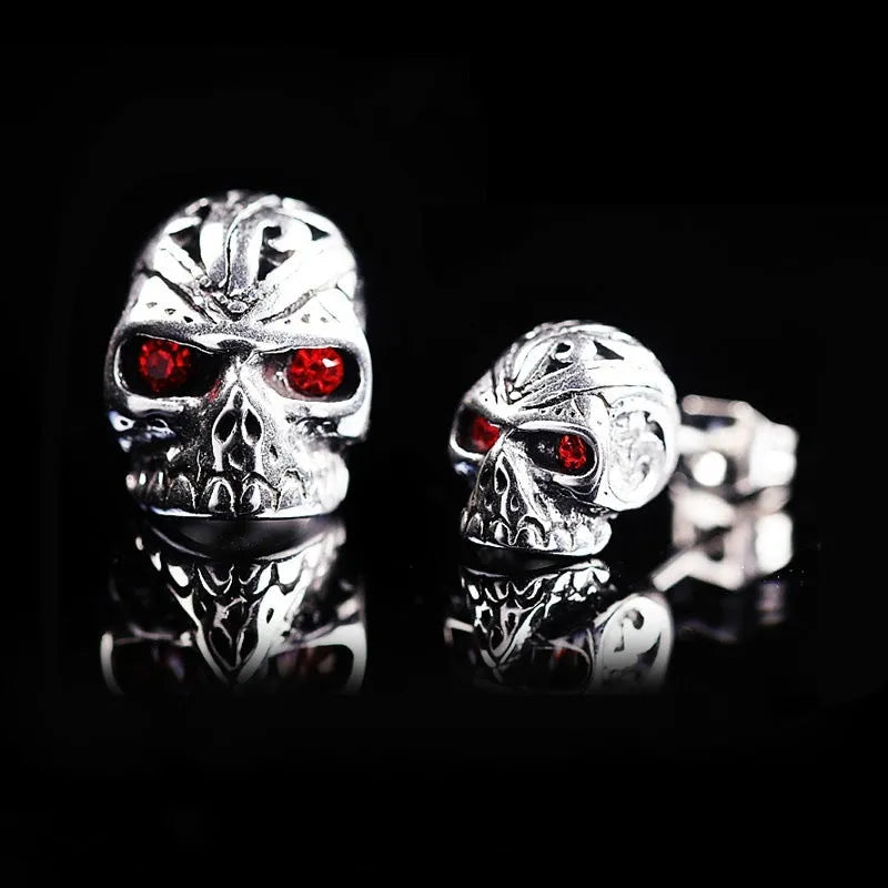 Retro skull stud earrings with red eye detailing and artificial gemstone inlay on alloy metal