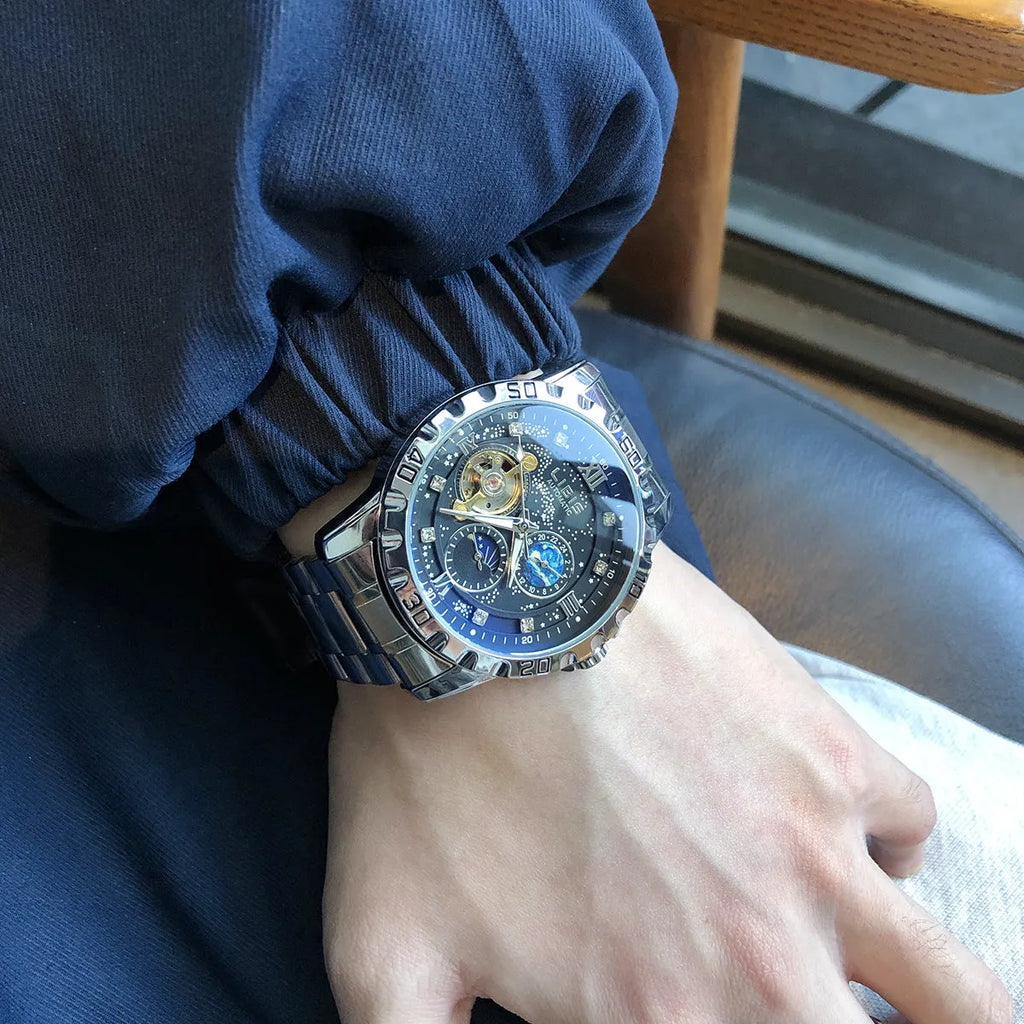 Men's silver automatic mechanical watch with black starry dial and luminous hands on leather strap