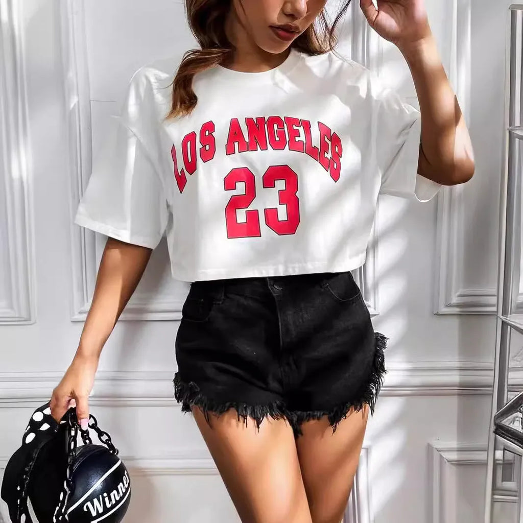 A loose fit black cotton T-shirt with white printed English letters and an exposed navel cut.