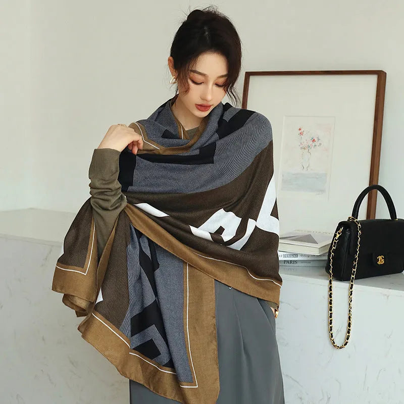 A woman wearing a printed polyester scarf, showing one of three style options, with dimensions of 180cm by 90cm.
