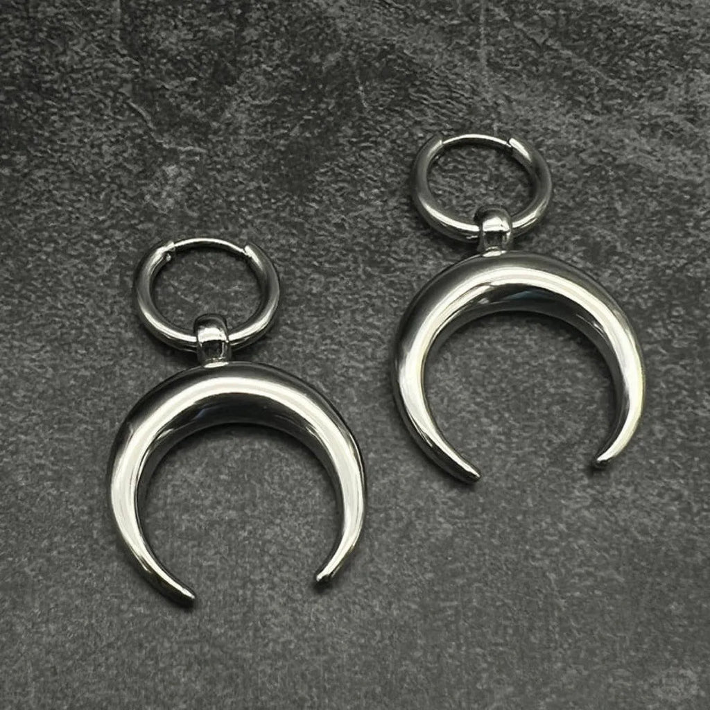 Silver geometric hoop earrings with moon motifs and ear clip fastening