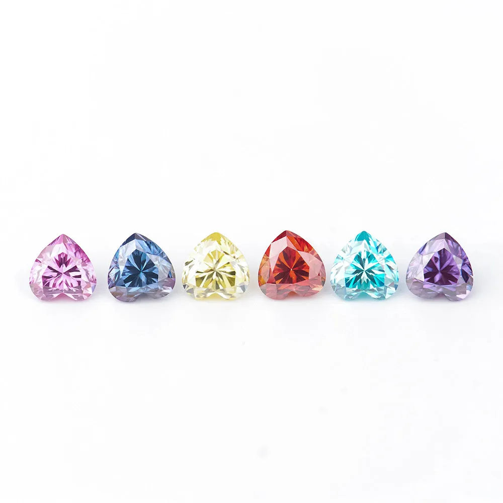 A loose lemon yellow moissanite gemstone cut into a heart shape, shown alongside other colour options.