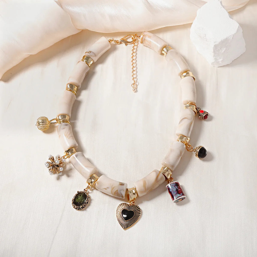 Women's resin bamboo heart necklace with electroplated metallic accents