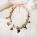 Women's resin bamboo heart necklace with electroplated metallic accents
