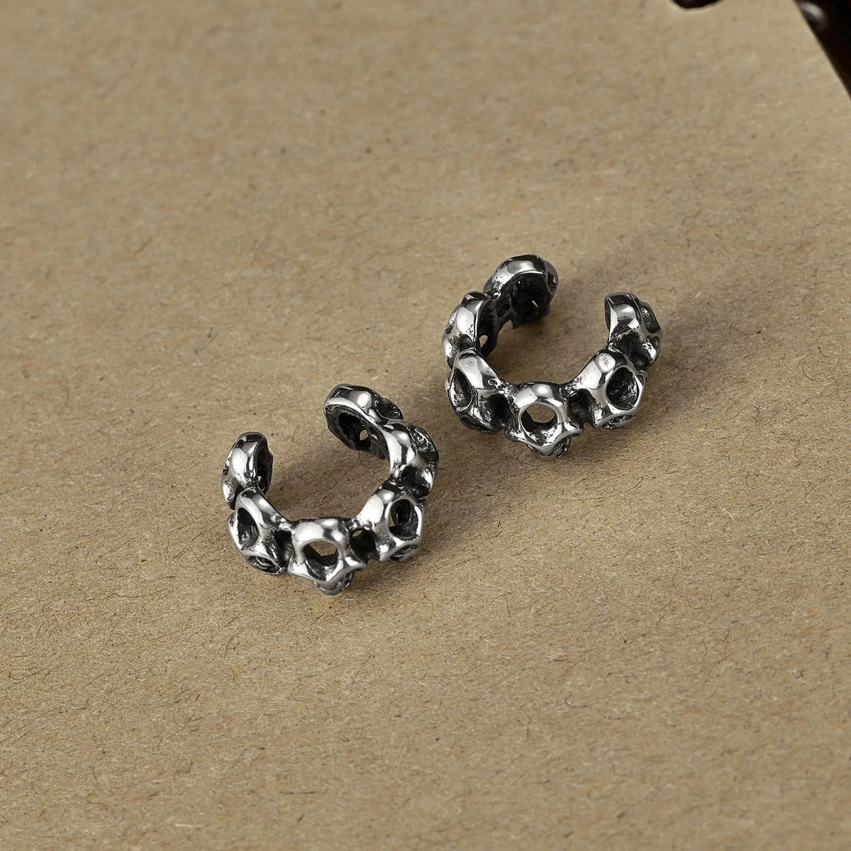 Retro hollow skull stainless steel ear clip earrings for men and women