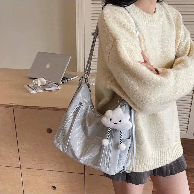 Soft black PU women's fashion backpack with a detachable silver pendant charm.