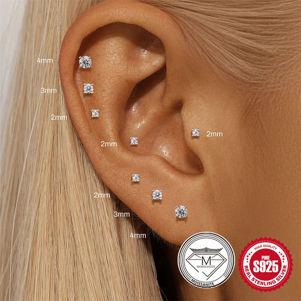 S925 sterling silver stud earrings with geometric petal design in platinum colour on ear.