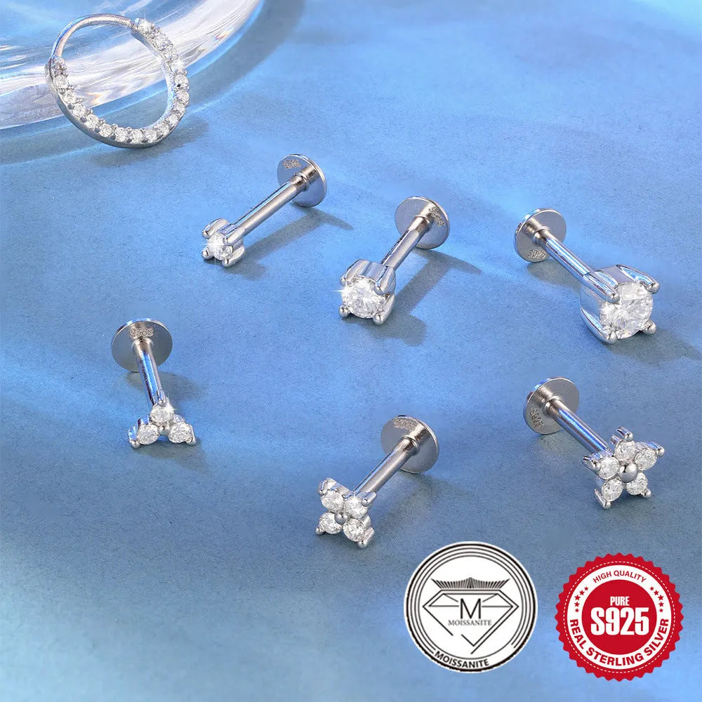 S925 sterling silver stud earrings with geometric petal design in platinum colour on ear.