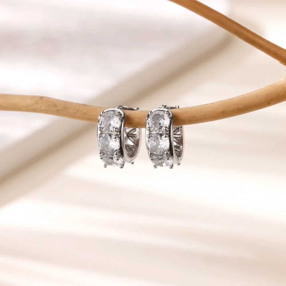 Gold-colour U-shaped clip earrings for women with inlaid zircon stones.