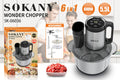 Stainless steel meat grinder and vegetable cutting machine on a kitchen counter