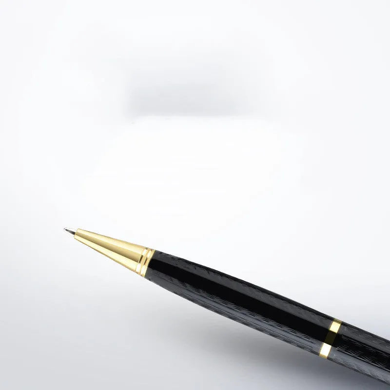 Black pen-shaped audio recorder with zinc alloy body shown next to included headset and data cable.