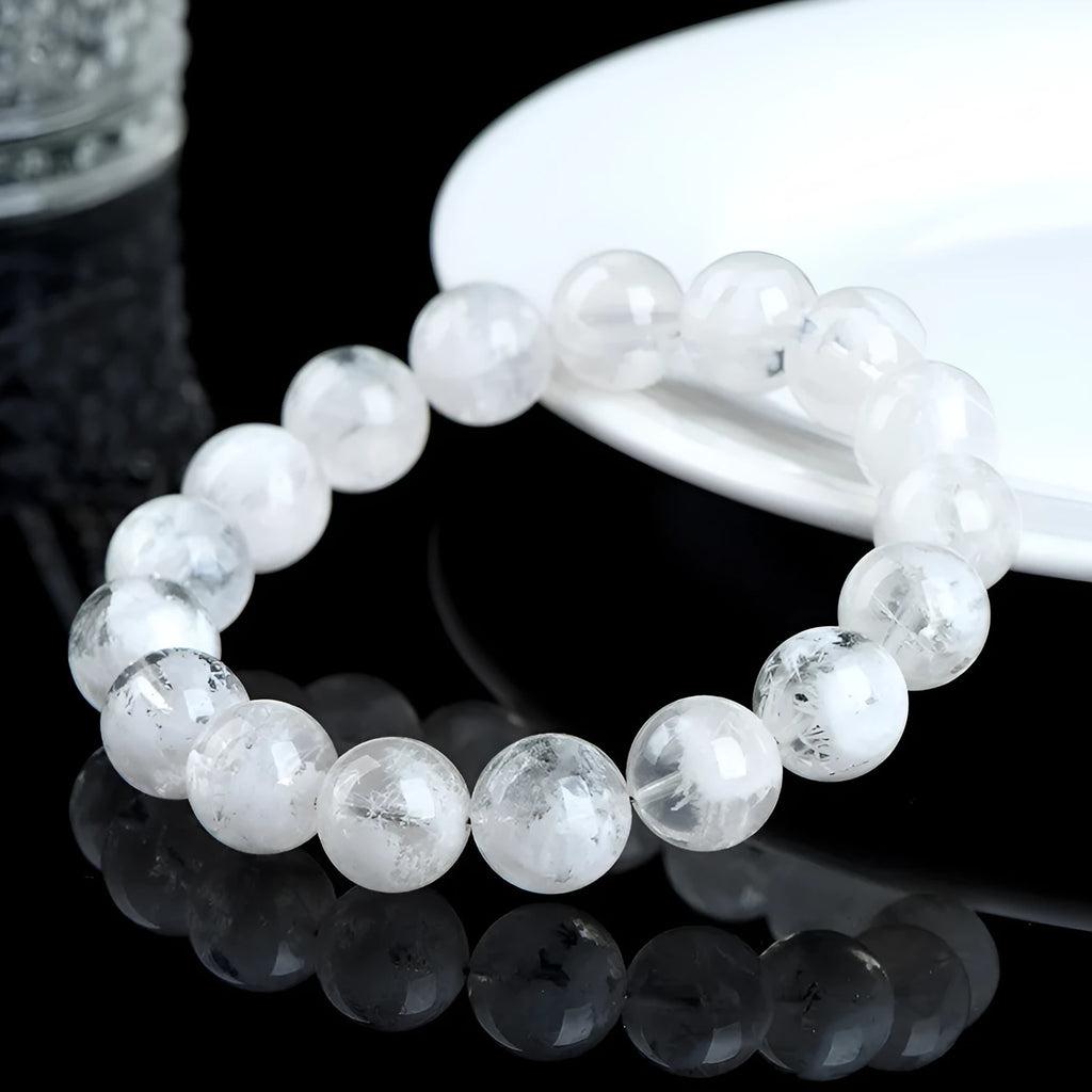 Women's crystal bracelet with round blizzard snowflake beads and ruyi xiangyun charm.