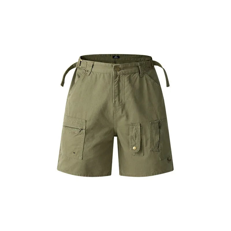 Men's and women's grey washed cotton retro workwear shorts with a loose fit and half elastic waistband on a hanger.