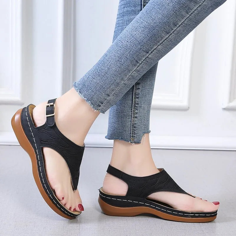 Women's casual wedge heel sandals with an adjustable buckle strap in red.