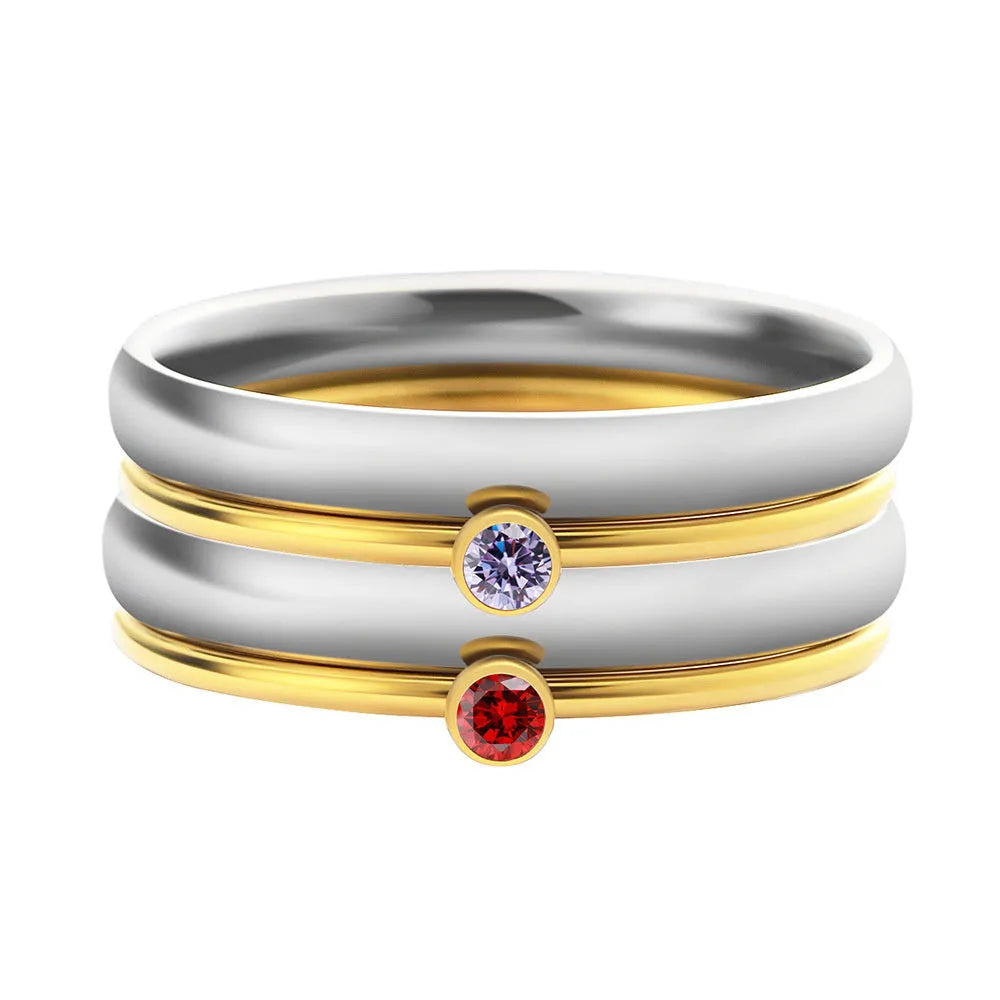 December birthstone engraved titanium steel ring with geometric design on a grey background.