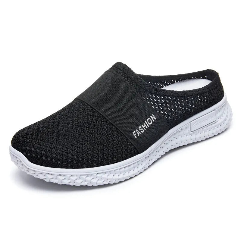 Women's black mesh casual flat shoes with hollow-out design and round toe on a flat heel.