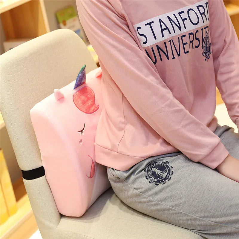 Cartoon character memory foam car cushion with removable core in pink unicorn design on a car seat