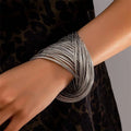 Irregular open cuff bracelet in electroplated zinc alloy with round ring and branch design, simple style
