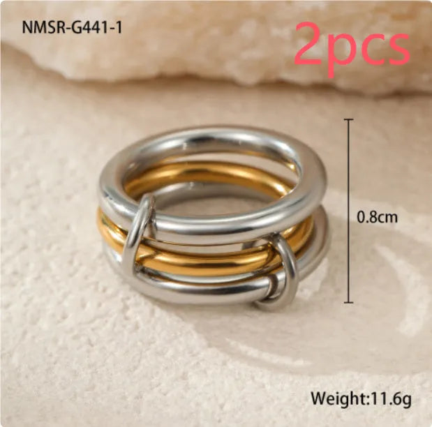 Women's stainless steel ring set with gold plating and stacked colour matching designs