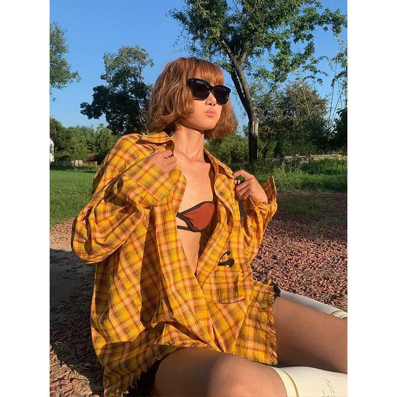 Dopamine yellow plaid loose fit shirt on hanger showing cardigan style and chemical fibre blend fabric