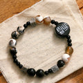 Hand-woven unisex bracelet with natural glitter stone, black agate, ceramic and round geometric beads