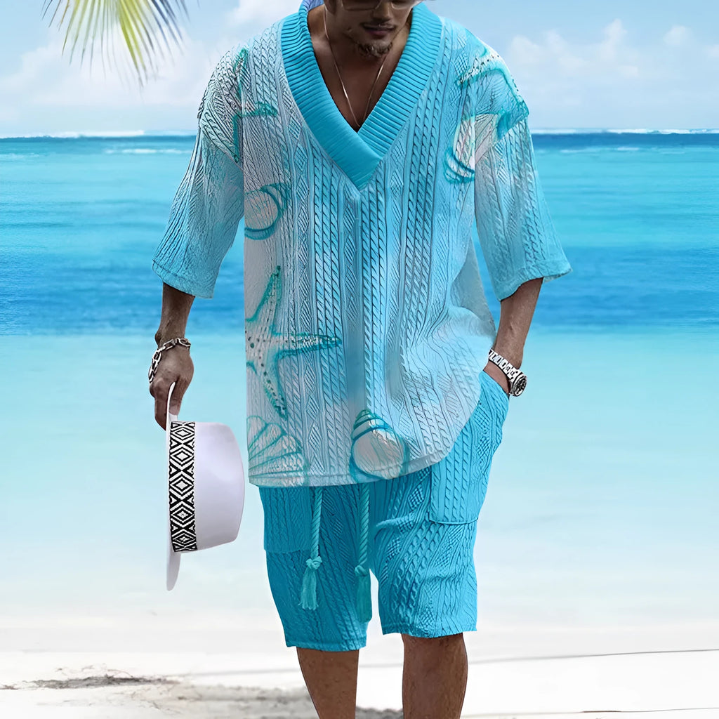 Man wearing a loose casual short sleeve suit top and matching shorts in a solid colour