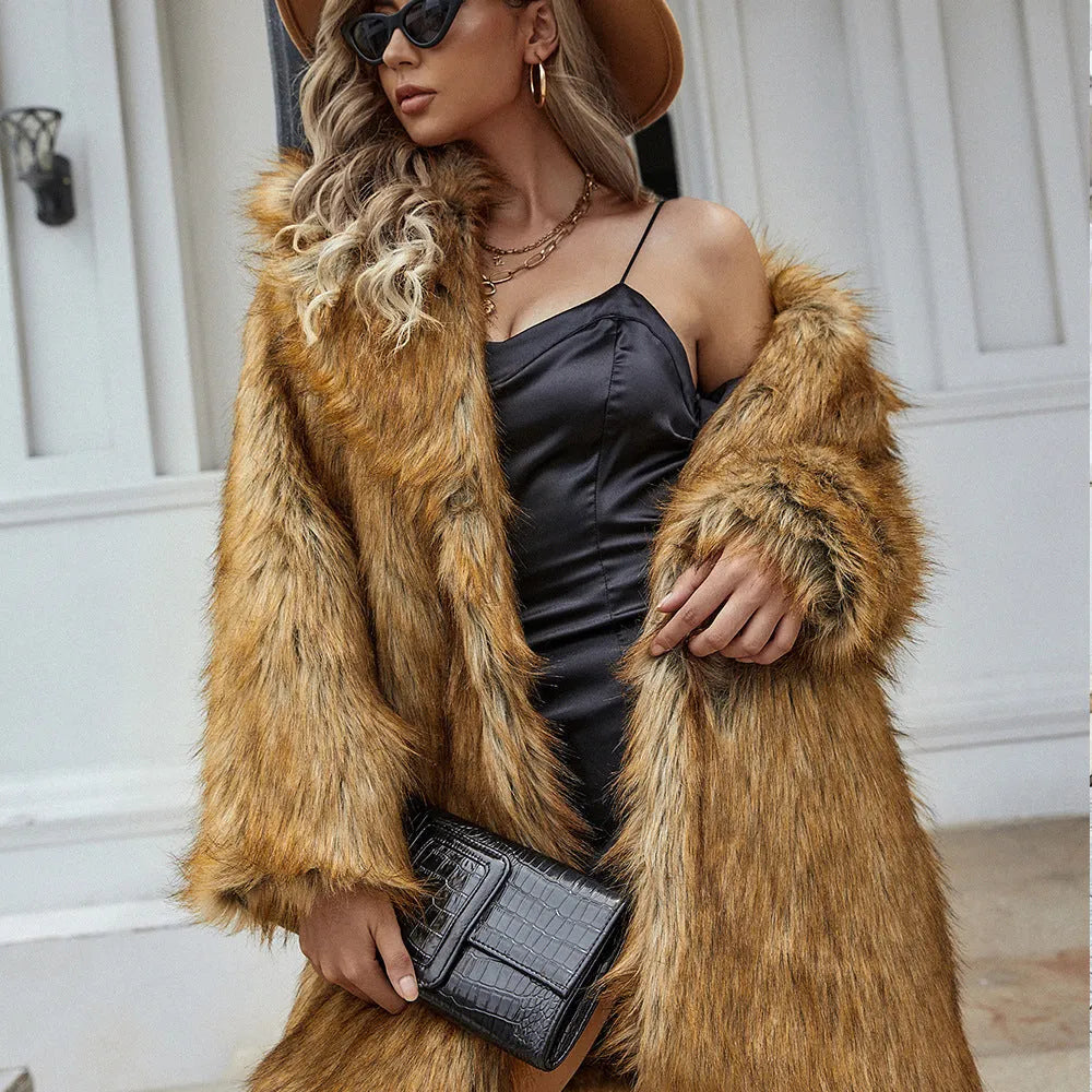 Yellow women's loose mid-length faux fur coat on a hanger.