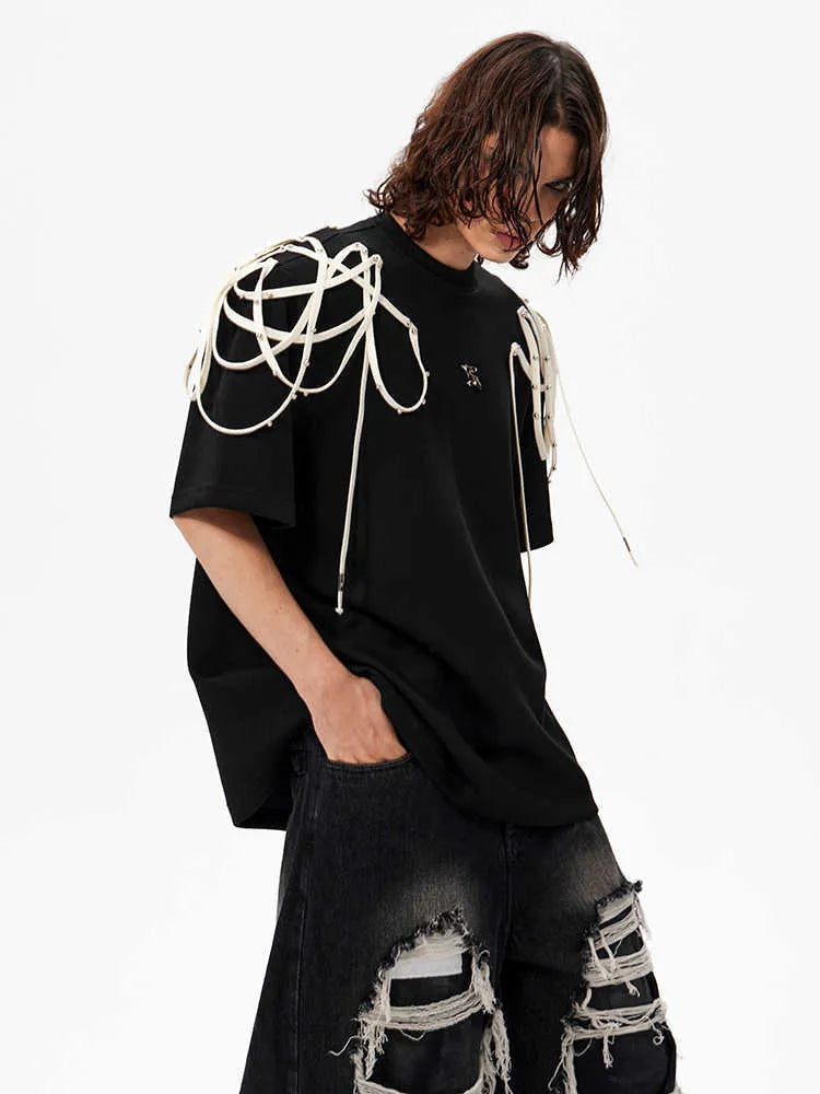 Black short-sleeved t-shirt with padded shoulders and rivet ribbon detail in loose fit round neck style